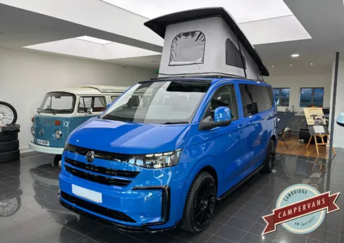 Photo of 2026 26 REG VW T7 150PS 8SP AUTOMATIC COMMERCE PRO SWB TAILGATE – HEATED STEERING WHEEL, LED EXCLUSIVE REAR LIGHTS – BRAND NEW CAMPERVAN CONVERSION -FIXED RIB BED – MID BLUE METALLIC